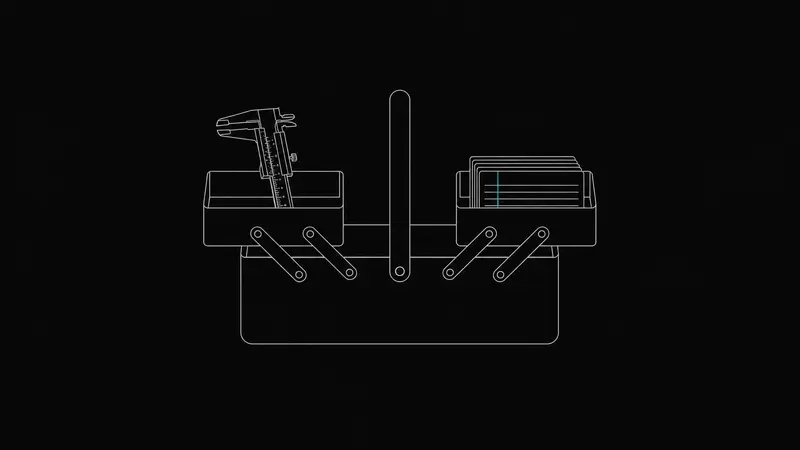 A toolbox with two trays, calipers in one and index cards in the other
